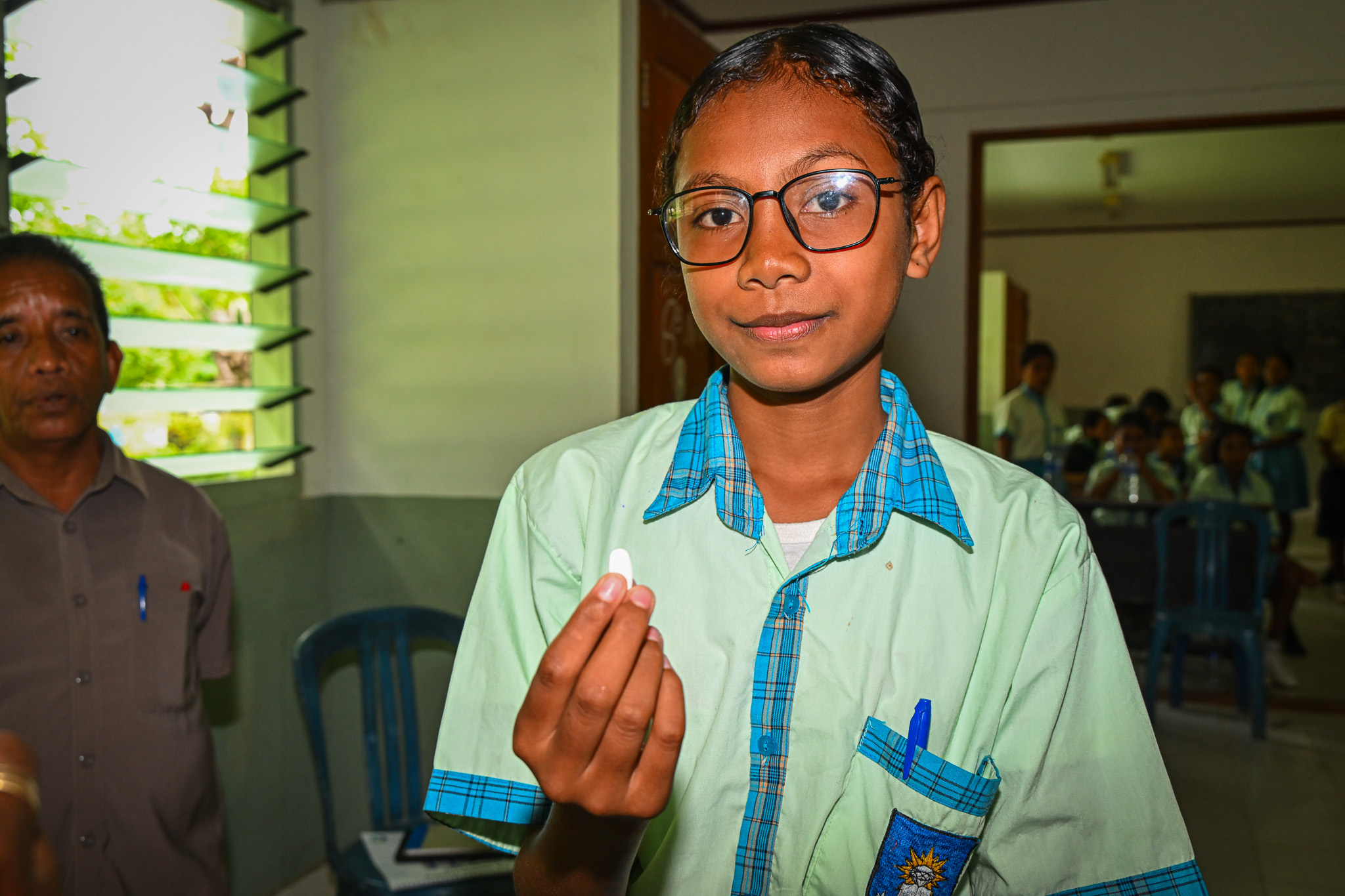 child about to drink albendazole