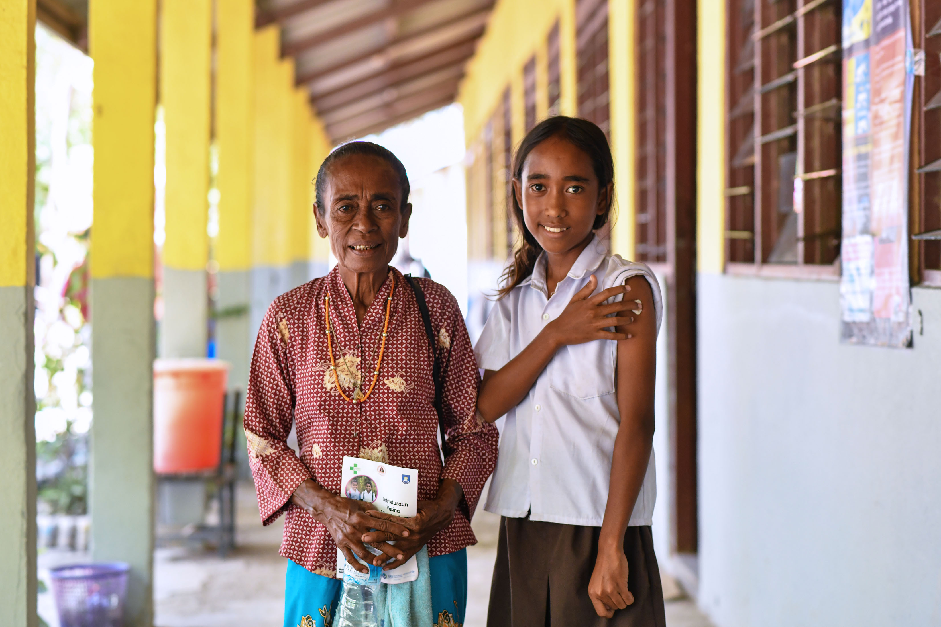 Agustina Maria with her grandmother post vaccination